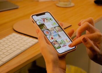 A photo of a person using Instagram on iPhone, showing Instagram stories decorations