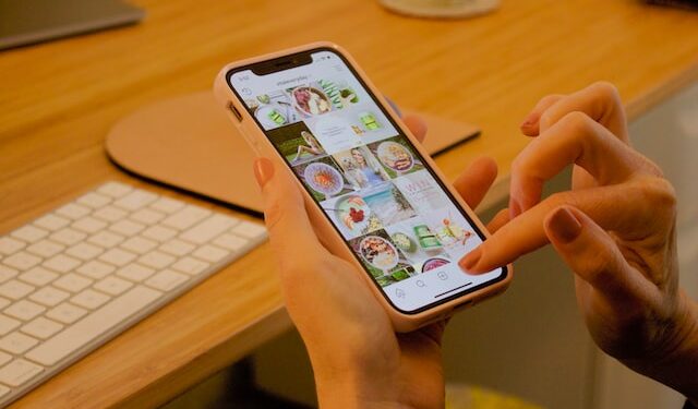 A photo of a person using Instagram on iPhone, showing Instagram stories decorations