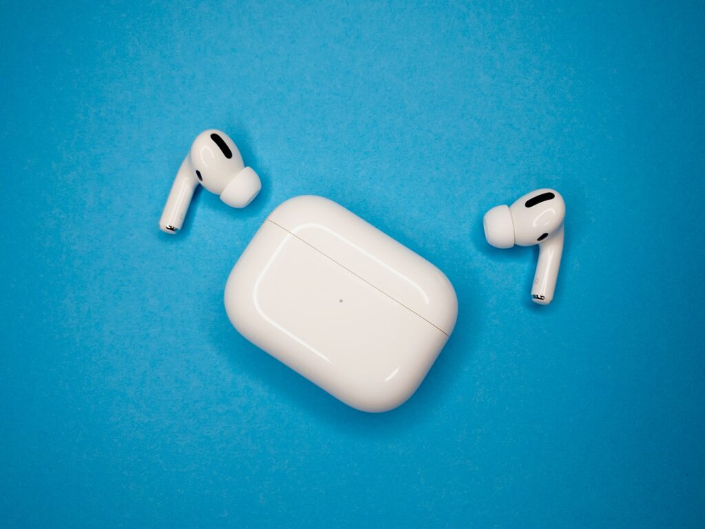 AirPods Pro placed on a table with light blue background