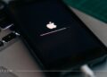 An iPhone getting Apple logo on a black screen while it's being updated