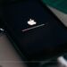 An iPhone getting Apple logo on a black screen while it's being updated
