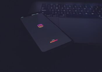 Instagram logo in a phone placed on a table