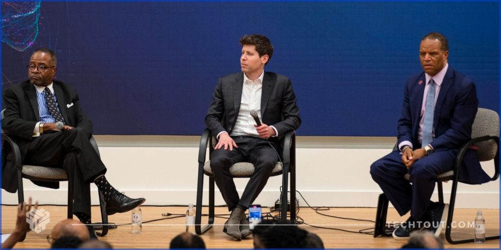 Sam Altman sitting in an AI conference